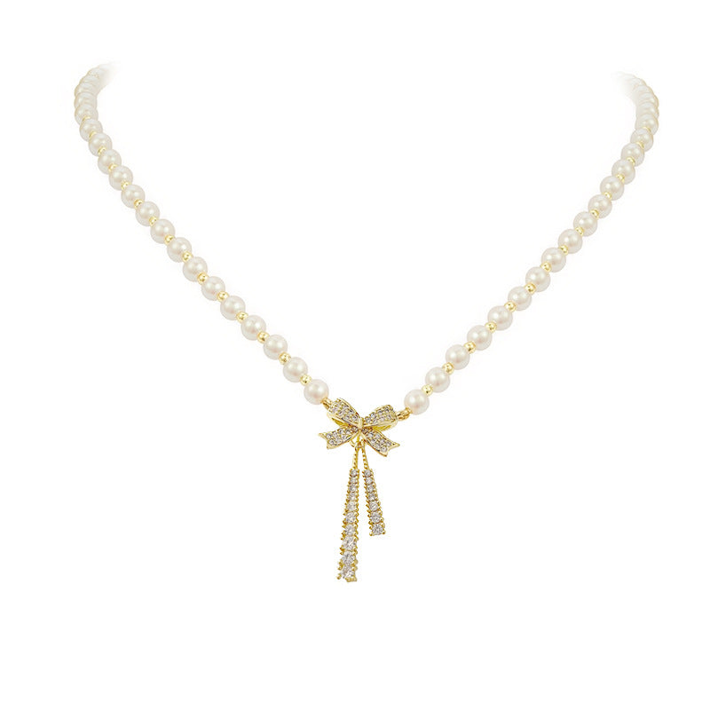 Faux Pearl Necklace With Rhinestone Bow Pendant CS Accessory Partners