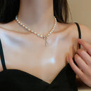 Faux Pearl Necklace With Rhinestone Bow Pendant CS Accessory Partners